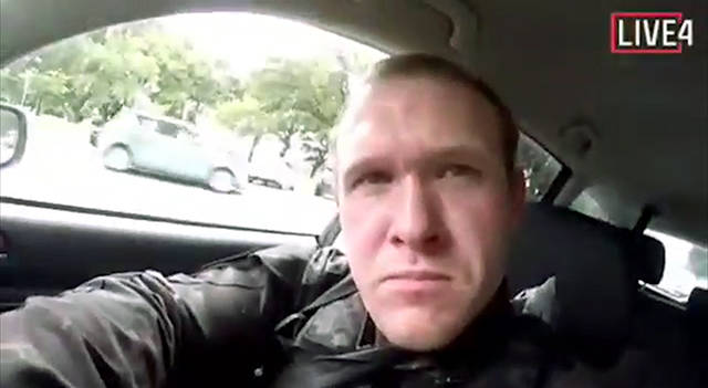 This frame from video that was livestreamed Friday shows a gunman, who used the name Brenton Tarrant on social media, in a car before the mosque shootings in Christchurch, New Zealand. (Shooters Video via AP)