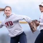 Glacier Peaks Harlee Carpenter (left) throws to first base, with teammate Kendall Curtis looking on during Thursdays practice. Led by their four college-bound standouts, the Grizzlies are looking to make noise in talent-laden Wesco 4A. (Kevin Clark / The Herald)