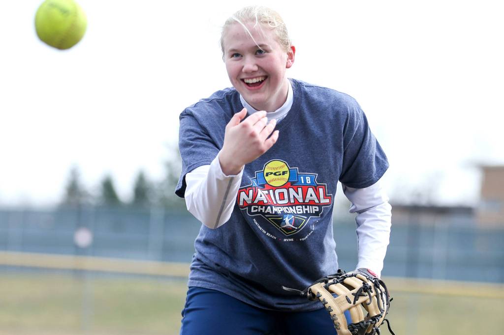First baseman Ashley Jacobson, who has committed to play Division I softball at Stony Brook in New York, shares a laugh during practice. (Kevin Clark / The Herald)