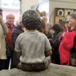 The unveiling of the statue drew quite the crowd to the Friedman Oens Gallery on Bainbridge Island. (Nick Twietmeyer / Kitsap News Group)