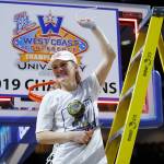 BYUs Paisley Johnson, a Glacier Peak High School alumna, cuts down part of the net after the Cougars beat Gonzaga in the championship game of the West Coast Conference tournament Tuesday in Las Vegas. Johnson was named the tournaments Most Outstanding Player. (AP Photo/John Locher)