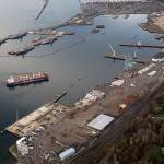 The bulk carrier Jamaica Bay is pushed into the Port of Everett by a pair of tugs near the former Kimberly-Clark mill site in January. (Andy Bronson / The Herald)