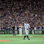 Seattle Mariners right fielder Ichiro Suzuki waves while leaving the field for a defensive substitution in the eighth inning of Game 2 of the Major League baseball opening series against the Oakland Athletics at Tokyo Dome in Tokyo on Thursday. (AP Photo/Toru Takahashi)