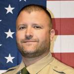 This undated photo released by the Kittitas County Sheriffs Office shows Deputy Ryan Thompson, who was shot and killed and a police officer was wounded after they exchanged gunfire with a road rage driving suspect Tuesday. (Kittitas County Sheriffs Office via AP)