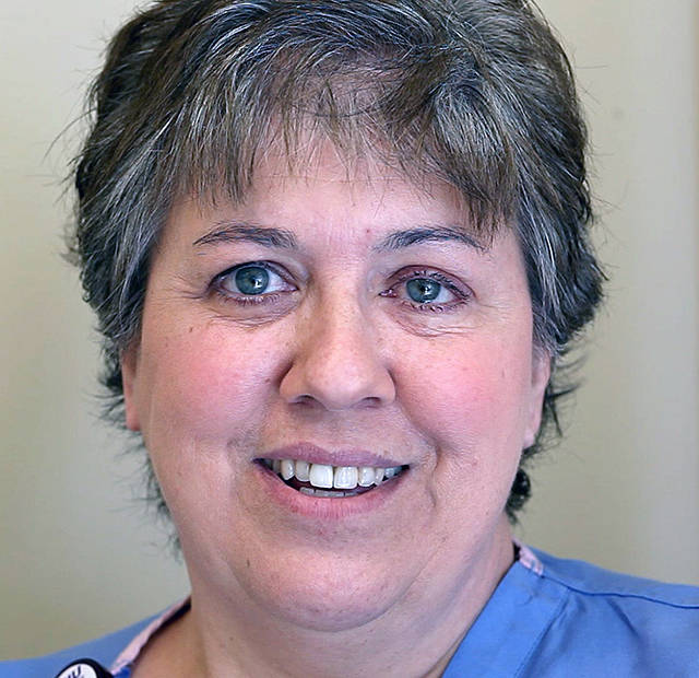 Lorraine Nations is a medical assistant at Cascade Valley Hospital. Her son Quinn was among those who helped save lives after the mudslide. (Mark Mulligan / The Herald)