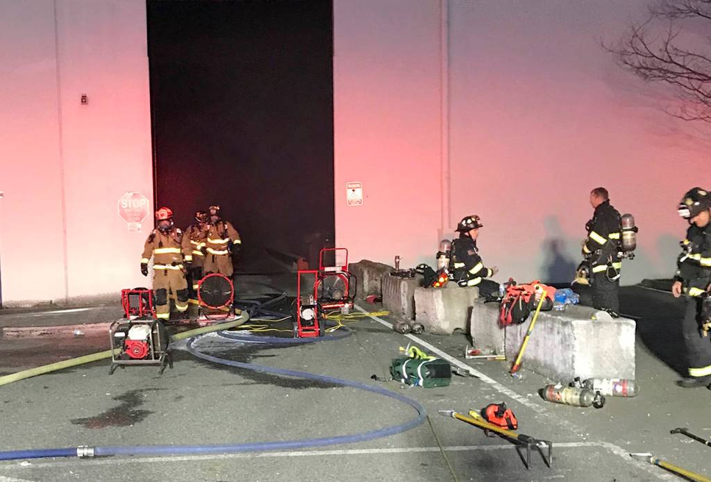 An employee discovered smoke and flames coming from a bale of newspaper and cardboard inside the Fibres International warehouse near Paine Field on Thursday night. (South County Fire)