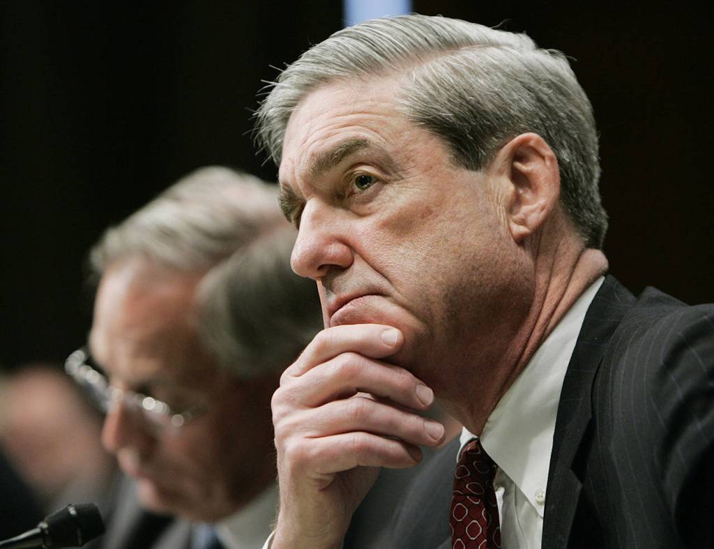 FBI Director Robert Mueller (right) and CIA Director Porter Goss testify before the U.S. Select Committee on Intelligence hearing to examine the world threaton Feb. 2, 2006, in Washington. (AP Photo/Manuel Balce Ceneta, file)