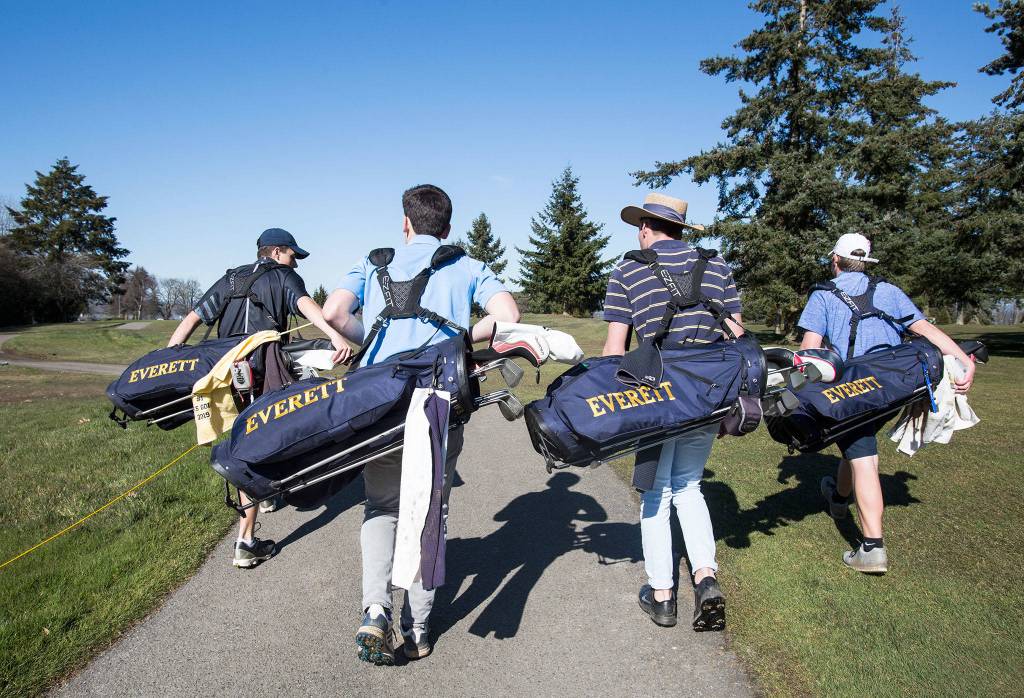 Everett High golfers (L-R) Austin Duffy, Andrew Olson, Ronny Kildall and Andrew Martin head to the fairway after teeing off during practice at Legion Memorial Golf Course on March 18, 2019 in Everett. (Andy Bronson / The Herald)