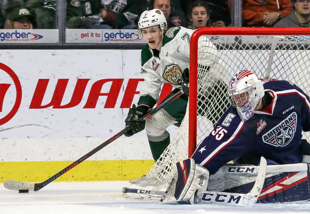 The Silvertips Martin Fasko-Rudas looks for a teammate with Tri-Citys Beck Warm defending the goal during Game 2 of a playoff series on March 23, 2019, at Angel of the Winds Arena in Everett . (Kevin Clark / The Herald)