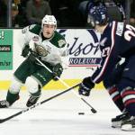 Everetts Connor Dewar controls the puck with Tri-Citys Nolan Yaremko defending during the first game of the playoffs Friday night at Angel of the Winds Arena in Everett. (Kevin Clark / The Herald)