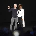 A parade of celebrities including Oprah Winfrey joined Apple CEO Tim Cook onstage Monday to promote the tech giants video-streaming service. (Bloomberg)