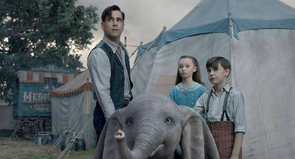 From left, Colin Farrell, Nico Parker and Finley Hobbins star as a family who takes care of the baby elephant in Dumbo. In this remake, none of the animals utter a word. (Walt Disney Pictures)