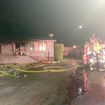 A man living in a mobile home and a firefighter were injured after the home caught fire early Tuesday morning north of Lynnwood. (South Snohomish County Fire/EMS)