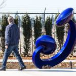 A man looks at the sculpture titled Aurora as he walks by at the new terminal at Paine Field on March 18 in Everett. (Andy Bronson / The Herald)