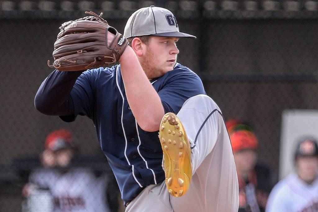 Glacier Peaks Noah Stingily winds up for a pitch against Monroe Wednesday afternoon at Monroe High School on March 27, 2019. The Bearcats won 9-1. (Kevin Clark / The Herald)