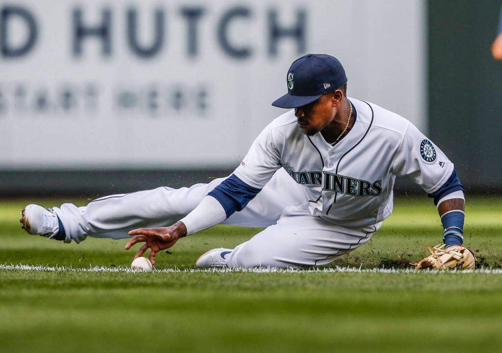 Mariners Tim Beckham slides to stop the ball during the Opening Day game agains the Boston Red Sox at T-Mobile Park on Thursday, March 28, 2019 in Seattle, Wash. (Olivia Vanni / The Herald)