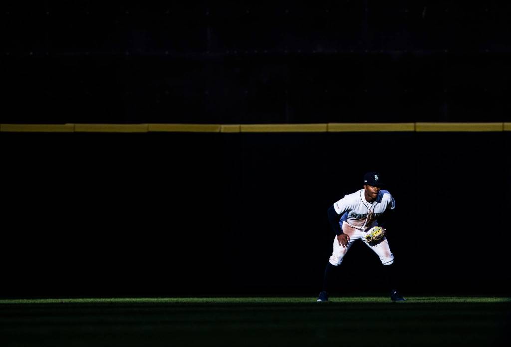Mariners Mallex Smith crouches in the outfield during the Opening Day game against the Boston red Sox at T-Mobile Park on Thursday, March 28, 2019 in Seattle, Wash. (Olivia Vanni / The Herald)