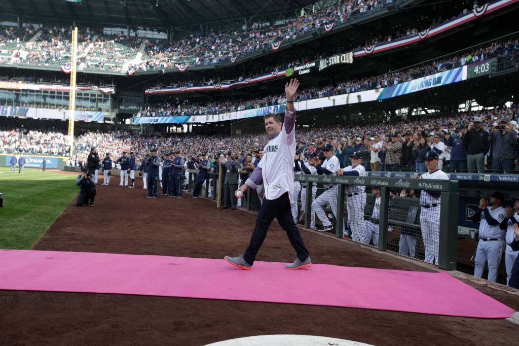 Future Mariner Hall of Fame inductee Edgar Martinez waves to fans before throwing out the first pitch as Seattle Mariners took on the Boston Red Sox at T-Mobile Park on Thursday, March 28, 2019 in Seattle, Wash. (Andy Bronson / The Herald)