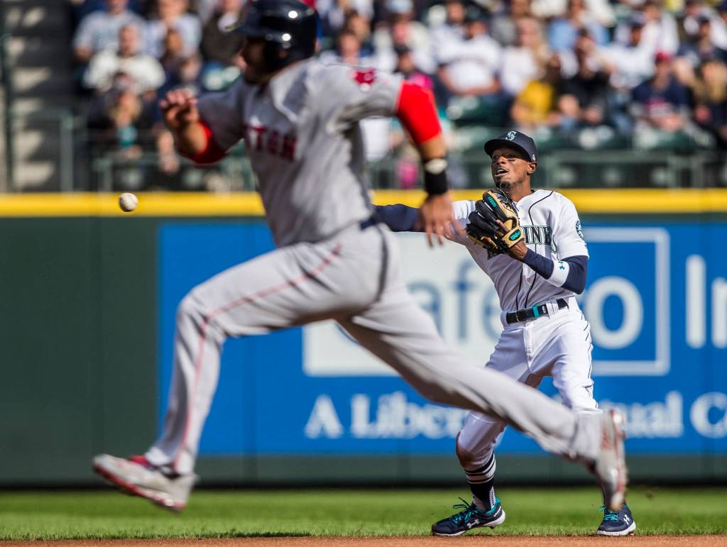 Mariners Dee Gordon makes a throw to second base during Opening Day game against the Boston Red Sox at T-Mobile Park on Thursday, March 28, 2019 in Seattle, Wash. (Olivia Vanni / The Herald)