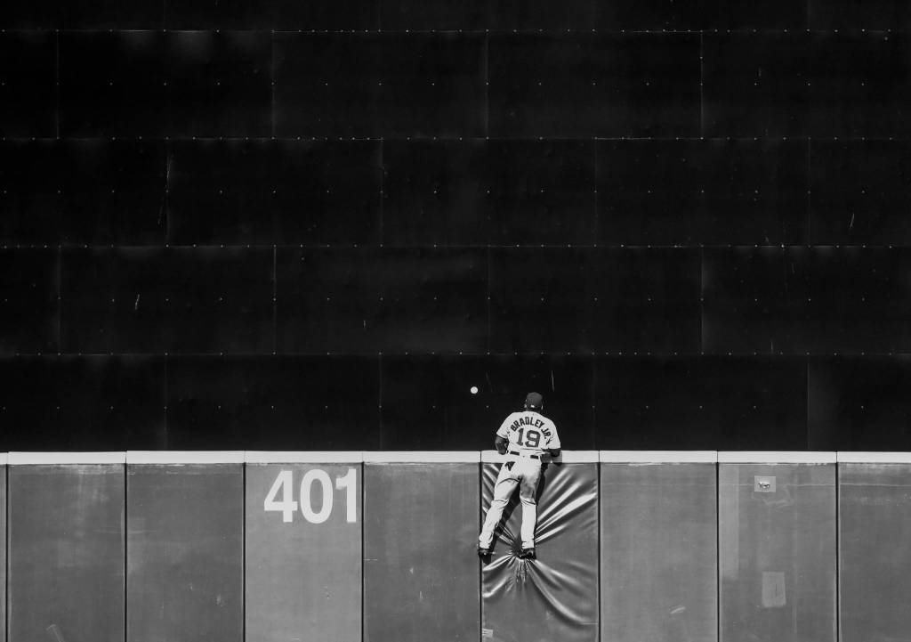 Red Soxs Jackie Bradley Jr. watches a a hit goes over the back wall during the Opening Day game at T-Mobile Park on Thursday, March 28, 2019 in Seattle, Wash. (Olivia Vanni / The Herald)