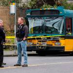 Several bullet holes can be seen in the drivers side window of a Metro Bus on Northeast 125th Street after a shooting in Seattle on Wednesday. (Dean Rutz/The Seattle Times via AP)