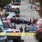 Looking north up Sand Point Way Northeast towards Northeast 123rd Street near the scene of a shooting in Seattle on Wednesday. (Steve Ringman/The Seattle Times via AP)