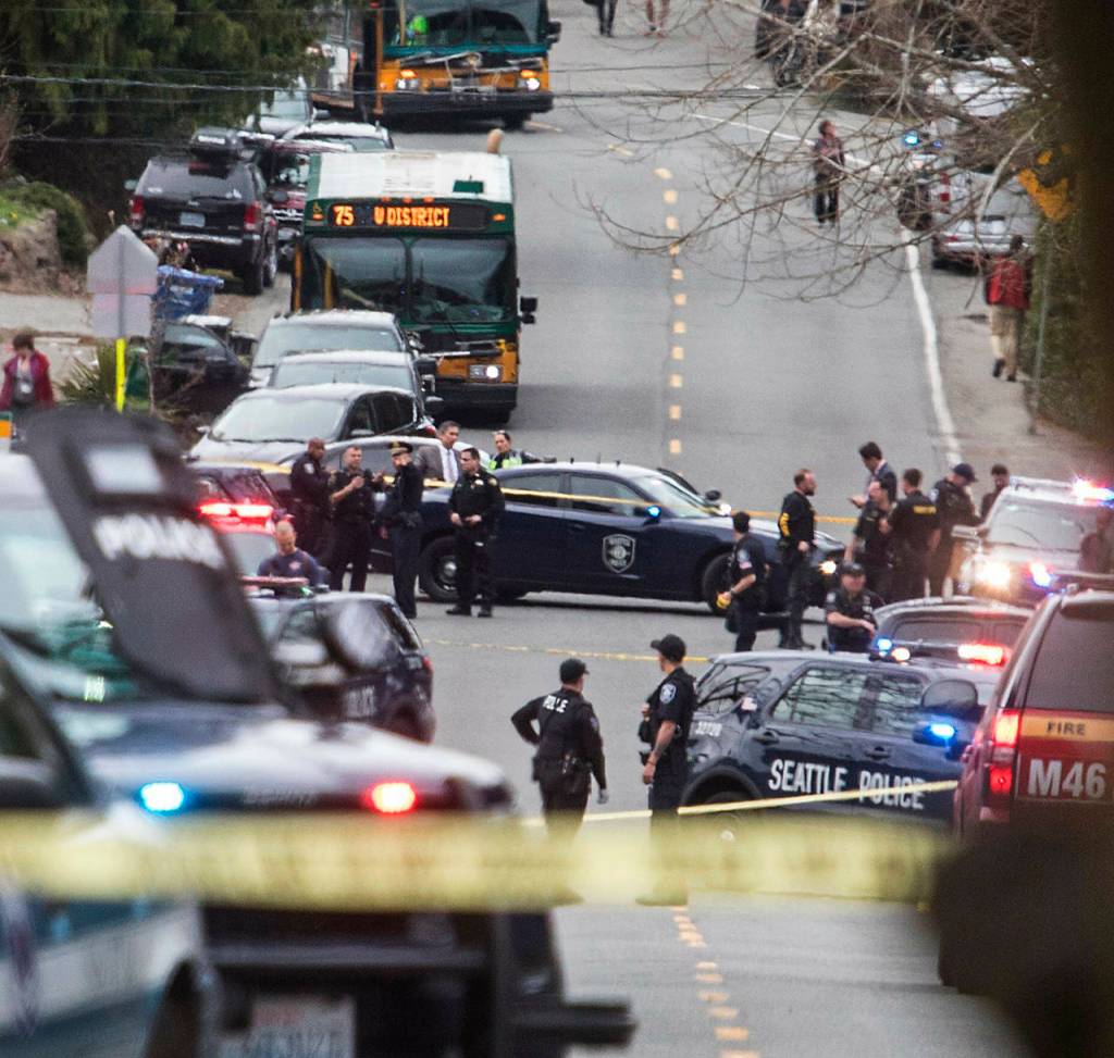 Looking north up Sand Point Way Northeast towards Northeast 123rd Street near the scene of a shooting in Seattle on Wednesday. (Steve Ringman/The Seattle Times via AP)
