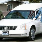 A hearse bearing the body of Kittitas County Deputy Sheriff Ryan Thompson arrives ahead of a memorial service Thursday at Central Washington University in Ellensburg. Hundreds of law enforcement officers from throughout the region have gathered for a memorial service for Thompson, who was shot to death by a road rage suspect last week. (Jake Green/The Daily Record via AP)
