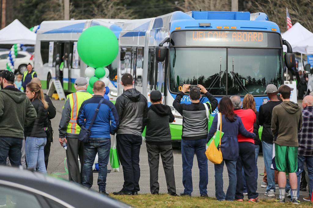 A bus makes its inaugural start of the Swift Green Line route during the kick-off celebration at McCollum Pioneer Park Everett on March 24. (Kevin Clark / The Herald)