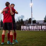 Stanwood seniors Corey Mourges (left) and Ben Dahlberg (right) hug before the game against Mountlake Terrace on March 26 in Stanwood. It was the seniors last game on their home field before construction begins. (Olivia Vanni / The Herald)