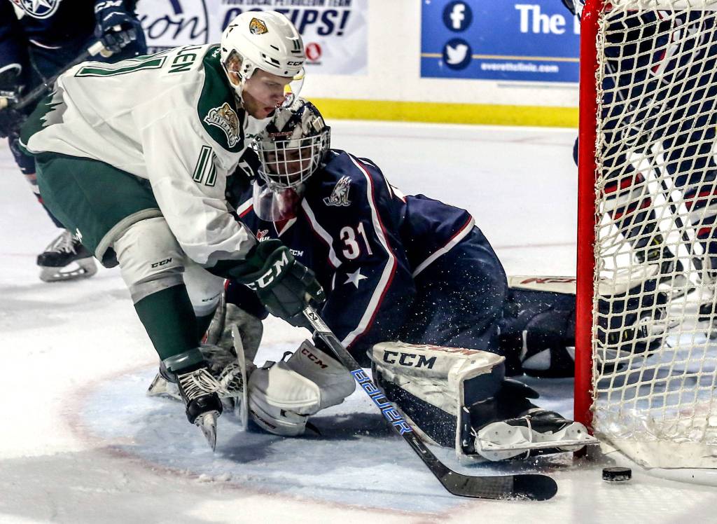 Everetts Lucas Cullen attempts a goal with Tri-Citys Talyn Boyko defending in the second period during game 5 of the playoffs Saturday night at Angel of the Winds Arena in Everett on March 30, 2019. (Kevin Clark / The Herald)