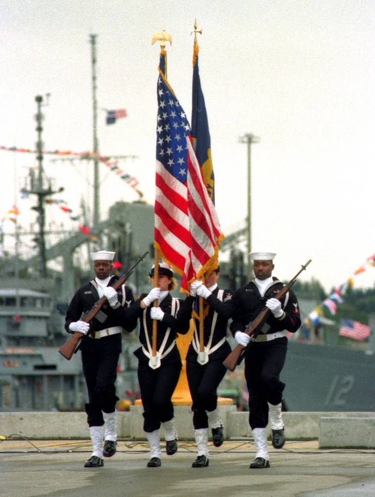 A U.S. Navy Color Guard presents the colors during the opening ceremonies of Naval Station Everett on April 8, 1994. (Michael OLeary / Herald file)