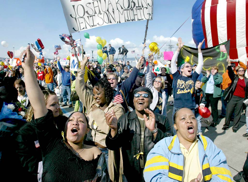 Friends and family pack the Naval Station Everett Pier as the USS Lincoln docks in May 2003. (Justin Best / Herald file)