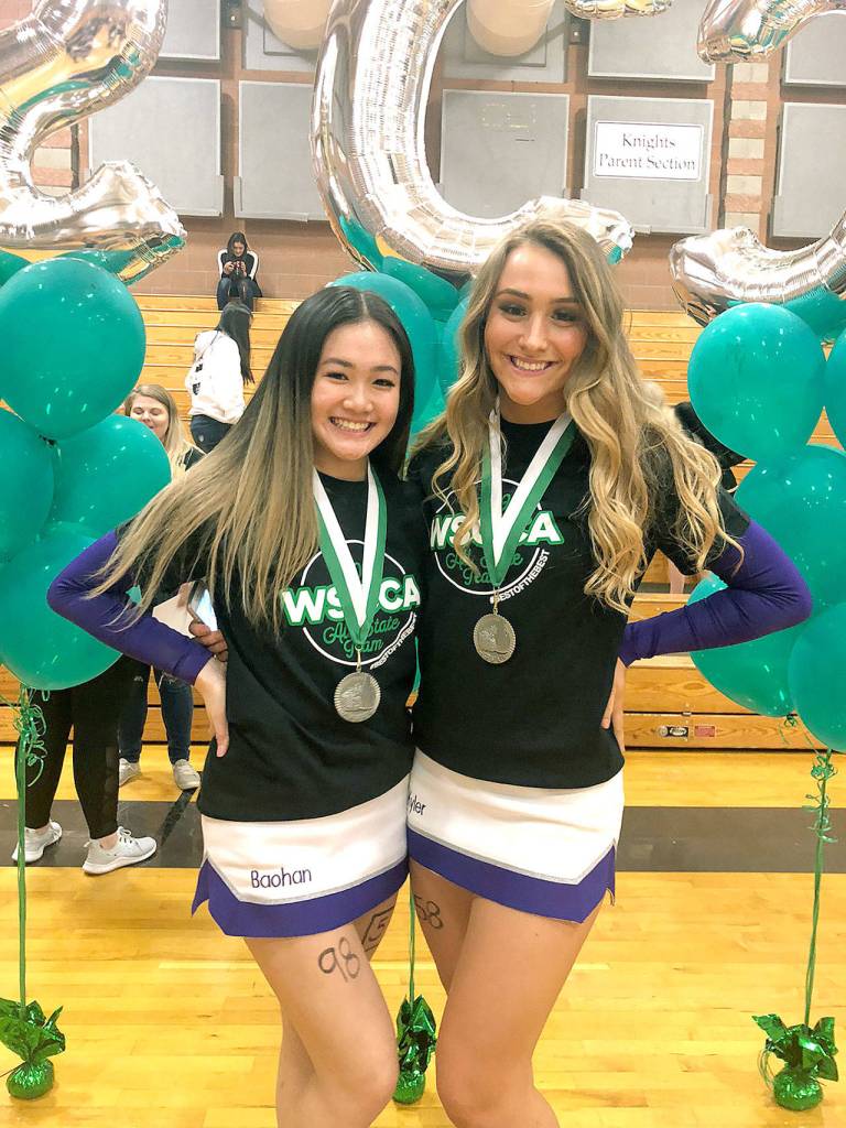 Kamiak all-state cheer team: Baohan Vo, left, and Kyler Lien.