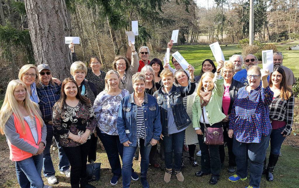 HH Photo                                 The Whidbey Island Eagles Aerie Board of Directors gathers with representatives of 12 island nonprofits after presenting the organizations with $15,000.