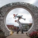 Silja Dos Reis and Jerome Sordillon, who play the lead characters in Cirque du Soleils Crystal, showing through April 14 at the Angel of the Winds Arena in Everett, pose in the moon of a piece titled The Convergence Zone in the Wetmore Theater Plaza. (Andy Bronson / The Herald)