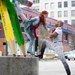 Silja Dos Reis and Jerome Sordillon pose with the statue of No. 2 pencils at the corner of Hoyt Avenue and California Street in Everett. (Andy Bronson / The Herald)