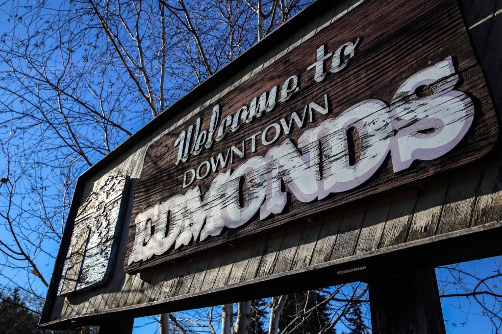 The old Edmonds sign that has stood for more than 40 years is faded and peeling. Proposals are in the works to replace it. (Kevin Clark / The Herald)