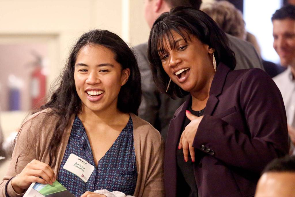 Andrea Estrella (left) and Emerging Leader finalist Ciera Graham share a laugh Thursday night at the Marysville Opera House. (Kevin Clark / The Herald)