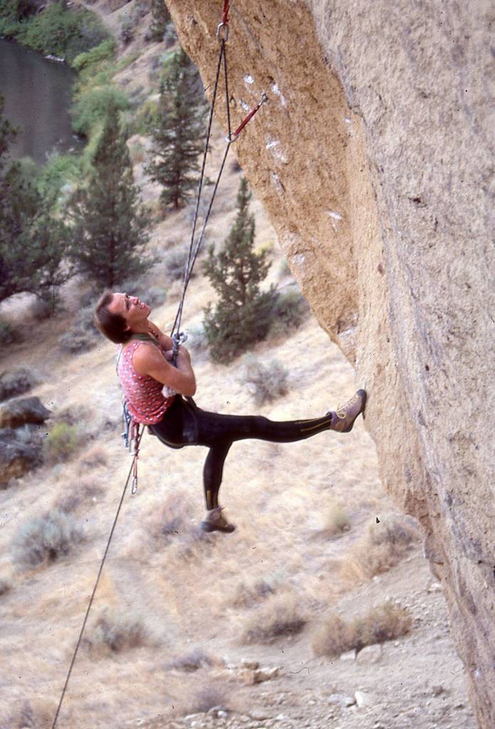 Alan Watts hangdogs while climbing the Rude Boys route at Smith Rock in Oregon in 1985. (Jeff Smoot)