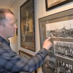 Polson Museum Director John Larson explains the process of creating guitar soundboards while showing photos from the Posey Manufacturing Company. (Louis Krauss / Grays Harbor News Group)