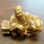 A detective purchased from an Everett man this figurine and two other items believed to contain elephant ivory, according to new charges. Officers later executed a search warrant on his home, and as a result, are holding more than 1,600 additional items they suspected may contain ivory. (Washington Department of Fish & Wildlife)