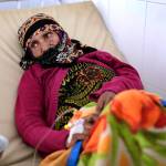 In this March 28 photo, an elderly woman is treated for suspected cholera infection at a hospital in Sanaa, Yemen. (AP Photo/Hani Mohammed, File)