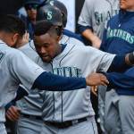 The Mariners Tim Beckham (right) celebrates in the dugout with Domingo Santana (16) after hitting a three-run home run against the White Sox during the fifth inning of a game on April 6, 2019, in Chicago. (AP Photo/Matt Marton)