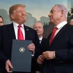 President Donald Trump smiles at Israeli Prime Minister Benjamin Netanyahu after signing a proclamation in the Diplomatic Reception Room at the White House in Washington on March 25. Trump isnt on the ballot for Israels national election, yet hes a dominant factor for many American Jews as they assess the high stakes of balloting on Tuesday, April 9, 2019. (AP Photo/Susan Walsh)
