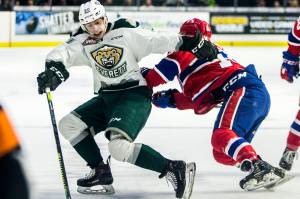 The Everett Silvertips Gage Gonclaves escapes a hit during the game against the Spokane Chiefs on Saturday, April 6, 2019 in Everett, Wash. (Olivia Vanni / The Herald)