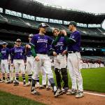 Edmonds-Woodways Karsen Tjarneberg walks down the first-base line and fist-bumps his teammates prior to Sundays game at T-Mobile Park, formerly known as Safeco Field. The Warriors faced Mount Si at the Seattle Mariners ballpark as part of the annual High School Baseball Classic. (Olivia Vanni / The Herald)