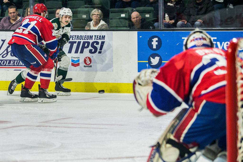 Silvertips Martin Fasko-Rudas watch the puck after taking a shot on goal during the game against the Spokane Chiefs on Sunday, April 7, 2019 in Everett, Wash. (Olivia Vanni / The Herald)