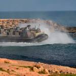 A U.S. amphibious hovercraft departs with evacuees from Janzur, west of Tripoli, Libya, on Sunday. The United States says it has temporarily withdrawn some of its forces from Libya due to deteriorating security conditions. The pullout comes as a Libyan commanders forces advanced toward the capital of Tripoli and clashed with rival militias. A small contingent of American troops has been in Libya in recent years helping local forces combat Islamic State and al-Qaida militants and protecting diplomatic facilities. (AP Photo/Mohammed Omar Aburas)