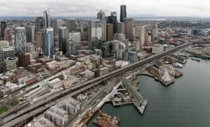 Downtown Seattle. In a city increasingly known for luxury towers and people living in tents and vehicles, some would-be council members are pledging to clean up the streets while others are promising to demand social and economic justice. (Washington State Department of Transportation)